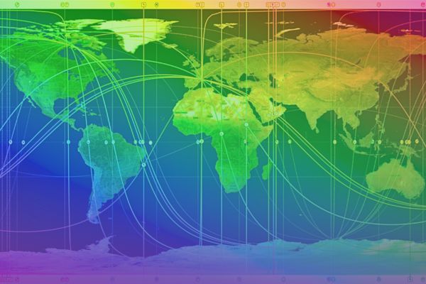 AstroMap of the world with planetary lines running over the continents and oceans, rainbow spectrum of colors